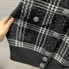 Femmes tricots manteau veste décontractée tricoté unisexe 2023 automne noir et blanc à carreaux Baseball chandail manteaux