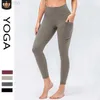 2023 Desginer Al Yoga Fitness Pantalons Taille haute pour femmes Abdominale Hanche Lift Pantalon de sport ajusté Poches latérales en forme de pêche Pantalon de hanche