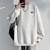 Solid round neck jacquard casual sweaters spring and autumn trends fashionable men's breathable pendant versatile clothing