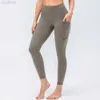 2023 Desginer Al Yoga Fitness Pantalons Taille haute pour femmes Abdominale Hanche Lift Pantalon de sport ajusté Poches latérales en forme de pêche Pantalon de hanche