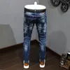 Męskie dżinsy streetwear moda moda retro niebieski splatany rozciąganie szczupła motocyklista Homme Painted Designer Hip Hop Ripped Pants Hombre