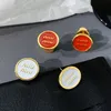 Lettre de marque de créateur mi'u émail lettre ronde boucles d'oreilles fièvre féminine même style boucles d'oreilles rétro tempérament haut de gamme boucles d'oreilles de luxe légères