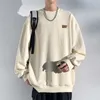 Solid round neck jacquard casual sweaters spring and autumn trends fashionable men's breathable pendant versatile clothing