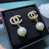 Neue 18K -Ohrringe mit luxuriösem Luxusmarken für Frauen Designer Schmuck Doppelbuchstaben Hütte Clip -Kette Geometrisch berühmte Kristallohrring Hochzeitsfeier Jewerlry