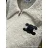 レディースTシャツデザイナー新しいランタンスリーブルーズとスリムな胸革ラベルラージポロ首ミルクアプリコットジッパーカーディガン