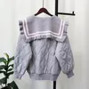 Tricots pour femmes automne hiver conception de col de poupée ample sensation épissé coton tricoté Cardigan doux pull manteau