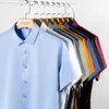 Camicie casual maschile estate a manica corta per uomo a colori solidi tratto morbido mezza camicia da uomo business 5xl fit regolare senza tasca anteriore 230823