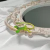 Hoop oorbellen Halloween -combinatie met groene hagedis oorclips zonder gaten modieus en creatief niche -ontwerp gekko bone clip