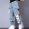 Uomini che colano pantaloni casual nastro tassella tasca hip hop joggers pantaloni cargo allenamento pantaloni per pantaloni per la tuta streetwearlf20230824.