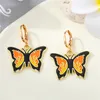 Pendientes colgantes 1 par de aro con colgante de mariposa de Metal para mujer, joyería de regalo, gota de insecto Simple y única AE27