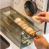 Kylskåp Egg Storage Box Automatiska skjutbara ägg Holder Rack Kök Matbehållare Kylskåp Sidan Dörr Organiser Daglig användning HKD230812