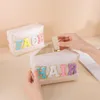 Custodia per cosmetici Custodia per ragazze Preppy Patch Impermeabile in ciniglia Lettera Cura della pelle Borsa da toilette portatile in pelle PU per uso quotidiano 230824