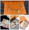 Designer di lusso Le lettere di portachiavi con diamanti Top Auto Chain Women Weibelry Borse Keyring Borse a ciondolo Squisito Regalo