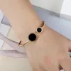 Braggle femminile in resina nera smalto dual round fascino bracciale in acciaio inossidabile coppia di cuffi a cuffia regalo natalizio