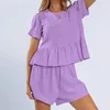 Abbigliamento da donna sexy set di pigiami set di cotone lino di cotone rotonda collo rotondo peplo a maniche corte pantaloncini a due pezzi abiti casual casual sciolti