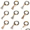 Keychains Lanyards Black Frosted Wooden Bead Bracelet Keychain Fashion Pattern Tassel Pendant Bracelets Women Girl Key Ring Wrist Otgma