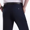 Calça casual masculina de alta qualidade de calças de paralisas de calça de vestido reto casual solto calças machos de terno preto plus size 40lf20230824.