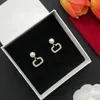 Hoge designer lichte luxe damespareloorbellen Gouden Stud Oorbellen Luxe Designer Sieraden Glanzende Charme Oorbel met Doos V Hoop Sieraden Engagement CHD superka