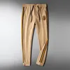 Pantalons pour hommes Mode Automne et Hiver Plus Velours Épaississement Kaki Rayures latérales Sports décontractés avec tenue à la mode 230824