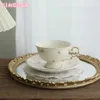 Tazze Tazza da caffè Coreano Retro Cremoso Giallo Pastorale Floreale Trafori Oro Ceramica Inglese Pomeriggio Dessert Fiore Tè e Piattino 230825