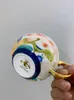 マグカップス中国のロイヤルスタイルティーカップとソーサーセットロータスパターン美しい花の骨骨庭園コーヒーカップ