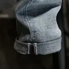 Mäns jeans rippade män mager ljusblå hög gata stil manlig elasticitet smal passform frayed casual byxor byxor biker 230825