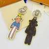 2023 Keyrings Классический рисунок кожаный матч -матч женский мультфильм -дизайнерские дизайнерские аксессуары модные сумки высококачественные шнурки для ключей