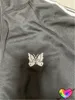 Męskie kurtki klasyczne igły sportowe kurtki mężczyźni kobiety haft motyla biała wstążka luźna futor płaszcz 230825