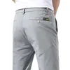 ¡Novedad de 2023! Pantalones Chinos caqui ajustados de seda hielo para hombre, pantalones informales de negocios elásticos de alta gama a la moda para primavera y veranoLF20230824.