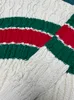 Pull tricoté personnalisé haut de gamme jacquard couleur assortie pull cardigan à col en V pour hommes et femmes du même style pull ample à rayures torsadées automne et hiver