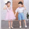 衣類は国際的な子供の日のパフォーマンス服をセットします小学校と中学校の卒業ガーデンボーイズガールズ