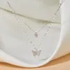 Nouveau collier papillon brillant dames exquis en acier inoxydable Double couche clavicule chaîne collier bijoux pour dames cadeau en gros YMN019