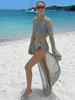 Conjunto de saia de praia com top curto de duas peças de malha de manga comprida vazada