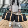 短距離旅行バッグ女性のファッションアウトハンドバッグメンズ荷物バッグ大容量防水トロリーケーストラベルバッグ