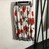 Eleganta blommor kvinnor toppar kjol byxor hög midja veckad kjol sexig stropplös topps retro stil blus halva kjol byxor set