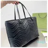 Large volume tote shopping v-shaped design Genuine Leather handbag brass accessories with ceramic effect facing cotton linen lining 10A