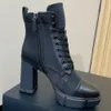 Top Brushed leather and nylon booties Black 1T427M Upper with enameled eyelets and hooks Leather lining enamel triangle Rubber sole Fashion Boots High heels boots