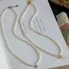 Hänghalsband pärlor små risformade pärlor halsband fina ljus lyxiga klavikelkedja hals nisch design