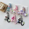 Acrylic colorful cute little whale dolphin plated uv pendant weave cloth rope key chain bag hanging rope