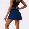 2024 lululemenI Tenues de yoga pour femmes Jupes de tennis taille haute Exercice Jupe plissée Pom-pom girls Robes courtes Porter des pantalons élastiques de course pour filles Vêtements de sport doublés