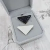 Classic designer triangle brooch, men's and women's temperament, trend, personality, coat, suit, brooch jewelry accessories