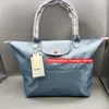 2024 Mode Groothandel Hoge Commuter Saccoche Kwaliteit Mummietassen Goedkope Grote winkel Hobo-capaciteit 90% korting Dames één schouder Strandhandtas Dumpling Bag Nylon