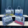 Kvällspåsar 2023 Ny graffiti tote väska för kvinnor largecpacity axel messenger väska mode trend kvinnors väska kreativ allmatch handväska j230830