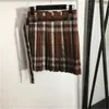 Designer-Zweiteiler-Set für Damen, Kleid, Karo-Anzug, kontrastierendes Plaid, Stehkragen, langärmelige Jacke mit Reißverschluss, hohe Taille, plissierter kurzer Rock, Designer-Kleidung für Damen