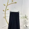 Юбки 2023 Последние высококачественные лоскутные камеры Сплошная черная сетчатая юбка для Ladies Summer Collection