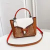 Bolsas de ombro femininas da moda com estampa geométrica combinando com cores