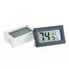 Thermomètres domestiques Nouveau noir/blanc FY-11 Mini Digital LCD Environnement Thermomètre Hygromètre Humidité Température Mètre dans la pièce RE Dhjqh