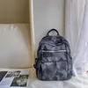 Korean leisure fashion anti-theft backpack fashion spring new camouflage waterproof nylon cloth light shoulder bag women 230830