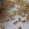 Nail Art Decorations 100PC Mini Lovely Bowknot Nail Art Decoration Retro Gold Chrome Bow-tie Alloy Charms 3D Butterfly Knot Parts Fingertips Ornament 230830