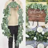 فو الأزهار الخضراء الأوكالبتوس جارلاند جدار الاصطناعي ديكور الفضة الدولار أوراق الكروم النباتية لقوس الزفاف 230829